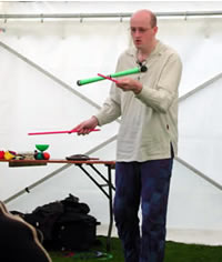 Steve the Juggler performing devilstick at Portsoy Boat Festival