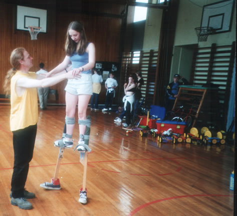 Tessa on stilts being assisted by Stevie Dalton